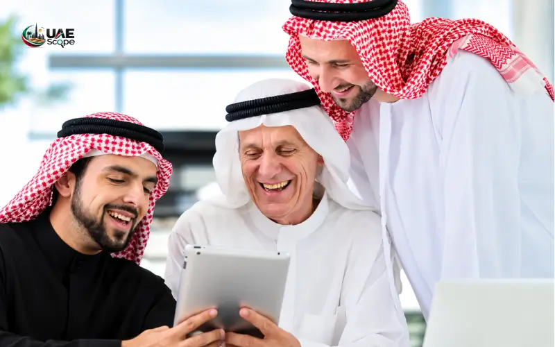 Arab men enjoying digital entertainment on a tablet together.